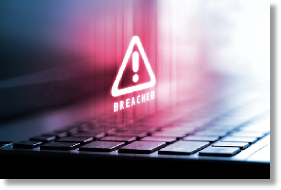 breach hazard symbol over a laptop keyboard