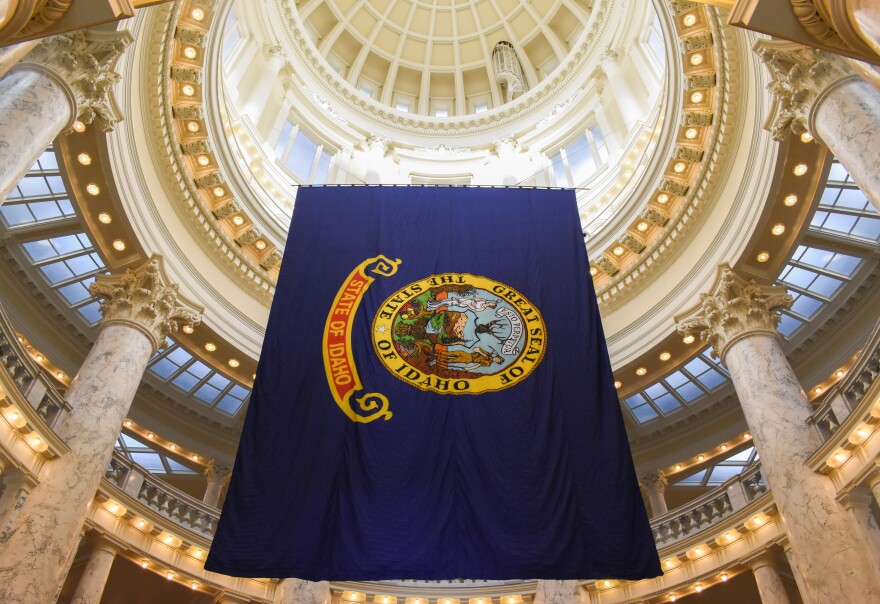 State of Idaho flag hanging from the State Capital building