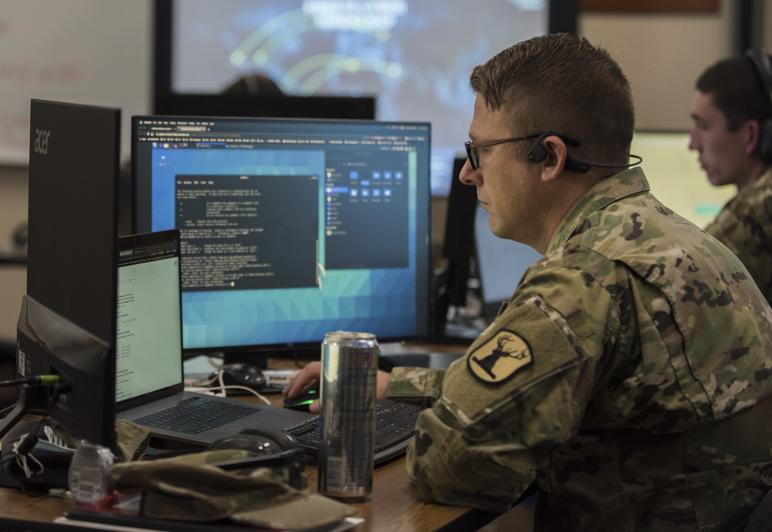 Image of military personnel working on a computer