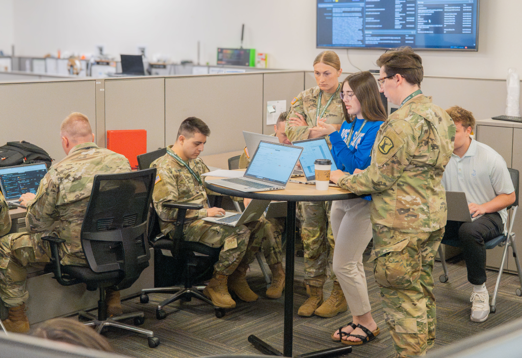 A cybersecurity team working on a laptop